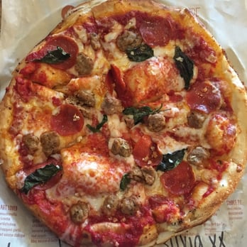 Blaze Pizza - BYO thick crust classic sauce, mozzarella, Parmesan, Italian sausage, pepperoni, basil, chopped garlic, salt - Pizza Near Me - Riverside, California