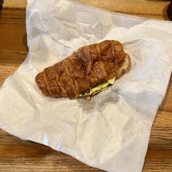 Caffe Aroma - Veggie breakfast sandwich on a croissant to go