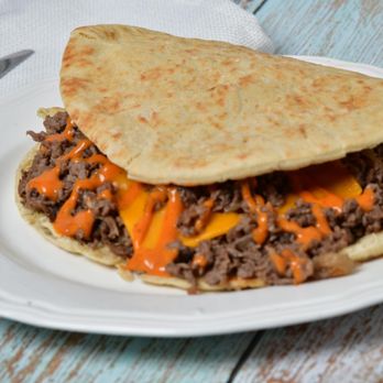 Steak Pita - a pita sandwich on a plate - Food Delivery Services Near Me - Washington, DC, District of Columbia Steak Pita - a pita sandwich on a plate - Food Delivery Services Near Me - Washington, DC, District of Columbia