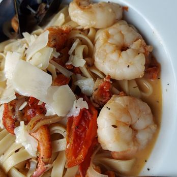 11 Central - Oh my big shrimp, lobster clawmeat, scallops, mussels  and tomatoes over fettuccine  with a tasty broth with just a touch of red pepper - Seafood Near Me - Bangor, Maine