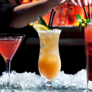 Atlantis Jax - three cocktails on ice with a bar in the background - Lounges Near Me - Jacksonville, Florida Atlantis Jax - three cocktails on ice with a bar in the background - Lounges Near Me - Jacksonville, Florida