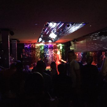 Flixx Lounge Omaha - a woman on stage performing - Gay Bars Near Me - Omaha, Nebraska