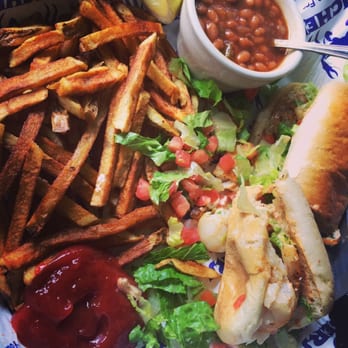 Pinchers - I had already started eating, not as pretty as when it's served- but this is a grilled grouper poboy, fries and baked beans. YUM - Seafood Near Me - Naples, Florida