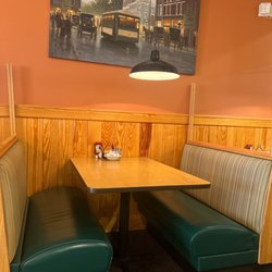 Sunny Street Cafe - Booth with beautiful pictures hanging