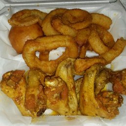 Garlic Parmesean wings with onion rings and a roll Garlic Parmesean wings with onion rings and a roll