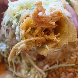 Chicken inside the Flautas, juicy and well seasoned Chicken inside the Flautas, juicy and well seasoned