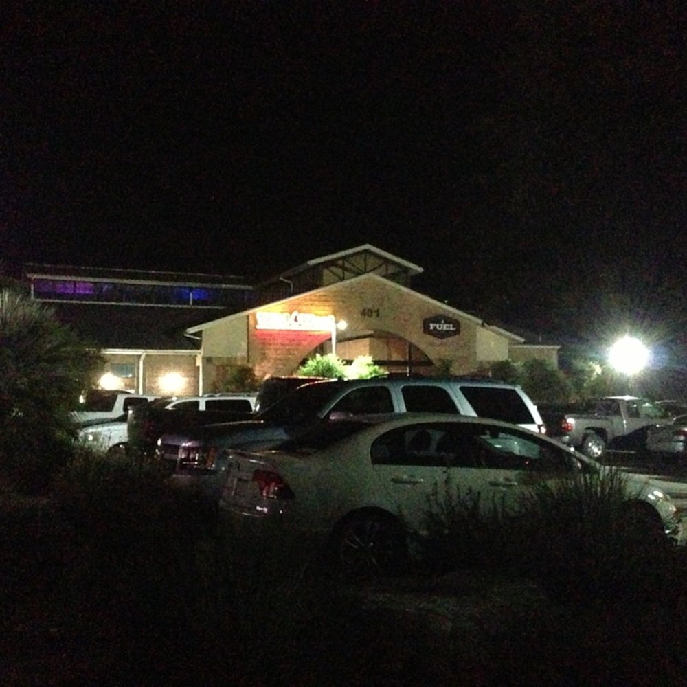 Wild West - Exterior at night - Bars Near Me - Cedar Park, Texas Wild West - Exterior at night - Bars Near Me - Cedar Park, Texas