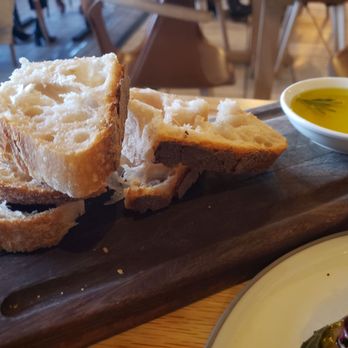 Terra - Otto bread and a VERY peppery olive oil. - Italian Near Me - Dallas, Texas Terra - Otto bread and a VERY peppery olive oil. - Italian Near Me - Dallas, Texas
