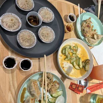 Steamies Dumplings - Soup dumplings, pot stickers, cucumbers, and sticky rice - all very yum! - Do-It-Yourself Food Near Me - Austin, Texas Steamies Dumplings - Soup dumplings, pot stickers, cucumbers, and sticky rice - all very yum! - Do-It-Yourself Food Near Me - Austin, Texas