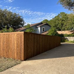 Elliott Fence - Side by side with staining and trim