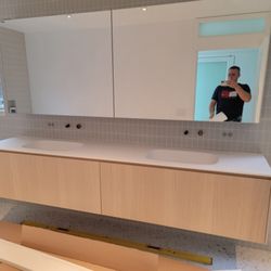 Anton Handyman - Cabinet and mirror installation.