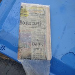 Courier-Journal Newspaper - Paper once again was thrown in the driveway in the pouring ran instead of being placed in my paper box WHERE IT SHOULD BE