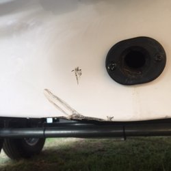 Neil's Marine & Outboard Service - It was hit hard with something or someone ran into it with something.
