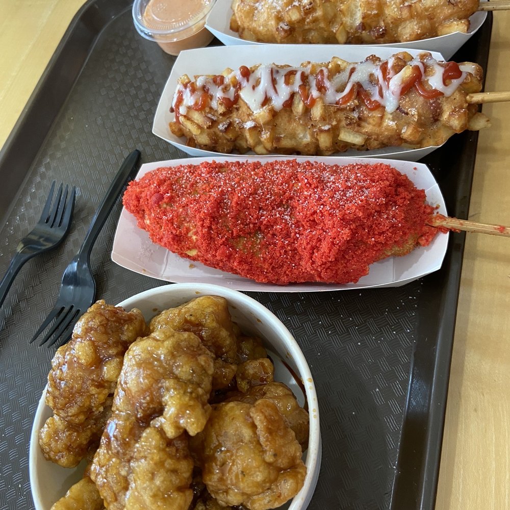 K-Stop - (Left to Right) Korean Fried Chicken Spicy Garlic Soy. All Cheese with Hot Cheeto Dust. 1/2 Beef/Mozz Potato Dog with Ketchup & Sweet Mayo. - Korean Near Me - Winston-Salem, North Carolina K-Stop - (Left to Right) Korean Fried Chicken Spicy Garlic Soy. All Cheese with Hot Cheeto Dust. 1/2 Beef/Mozz Potato Dog with Ketchup & Sweet Mayo. - Korean Near Me - Winston-Salem, North Carolina