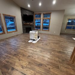 All Seasons Flooring & Construction - Living Room before base trim was put back on.