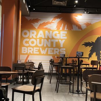 Orange County Brewers - tables and chairs in a restaurant - Breweries Near Me - Orlando, Florida Orange County Brewers - tables and chairs in a restaurant - Breweries Near Me - Orlando, Florida