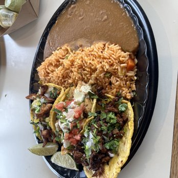 Guapo's GO, Taqueria & Charcoal Chicken - The taco plate with rice and beans! There's carne asada, chicken, and pastor! 10/10 on the tacos! - Mexican Near Me - Woodbridge, Virginia