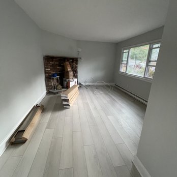 Powell Flooring - a living room with a fireplace - Flooring Near Me - West Milford, New Jersey Powell Flooring - a living room with a fireplace - Flooring Near Me - West Milford, New Jersey