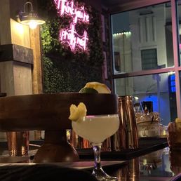 a dessert and a drink on a bar a dessert and a drink on a bar