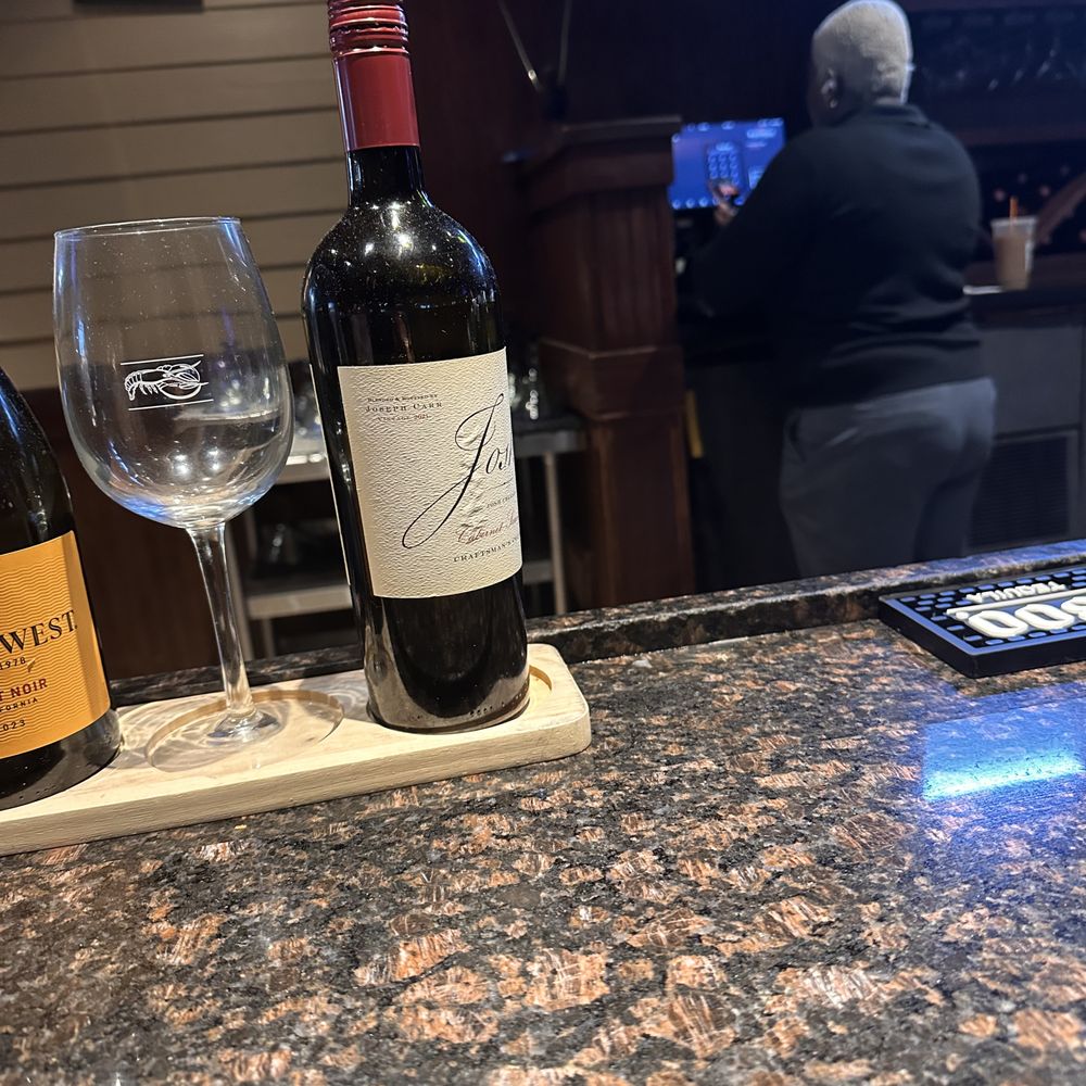 The bartender with her AirPods in her ears talking on the phone instead of greeting me