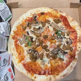 a whole pizza in a box