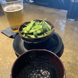 Edemame (soybeans) and a Miller Lite. Edemame (soybeans) and a Miller Lite.