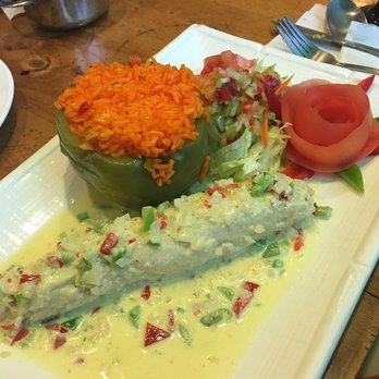 Mi Casa Restaurant - Ave Marina chicken dish (Chicken Breast Stuffed with shrimps in a white sauce. Accompanied by a Pepper stuffed with yellow rice) - Dominican Near Me - Utica, New York Mi Casa Restaurant - Ave Marina chicken dish (Chicken Breast Stuffed with shrimps in a white sauce. Accompanied by a Pepper stuffed with yellow rice) - Dominican Near Me - Utica, New York