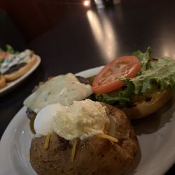 Sinclair's East - Cajun Burger with a baked potato.