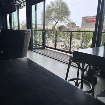 Trevor's Liquor - Looking out to the parking lot and a sitting outdoor area. - Beer, Wine & Spirits Near Me - Scottsdale, Arizona Trevor's Liquor - Looking out to the parking lot and a sitting outdoor area. - Beer, Wine & Spirits Near Me - Scottsdale, Arizona