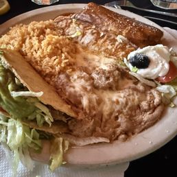 Compo plate=taco, tamale, and chicken enchiladas Compo plate=taco, tamale, and chicken enchiladas