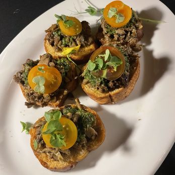 Sol St Pete Bistro - Mushroom bruschetta with basil pesto on house made crostinis - New American Near Me - St. Petersburg, Florida Sol St Pete Bistro - Mushroom bruschetta with basil pesto on house made crostinis - New American Near Me - St. Petersburg, Florida