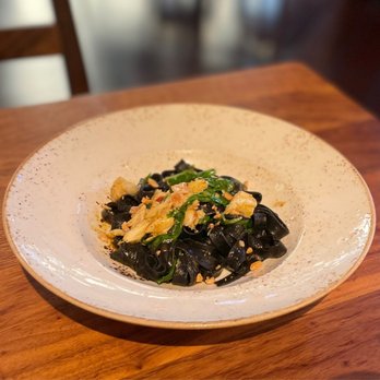Meril - Fettuccine Nero with squid ink pasta, calabrian chili, blue crab and other stuff. Portion was small - New American Near Me - New Orleans, Louisiana Meril - Fettuccine Nero with squid ink pasta, calabrian chili, blue crab and other stuff. Portion was small - New American Near Me - New Orleans, Louisiana