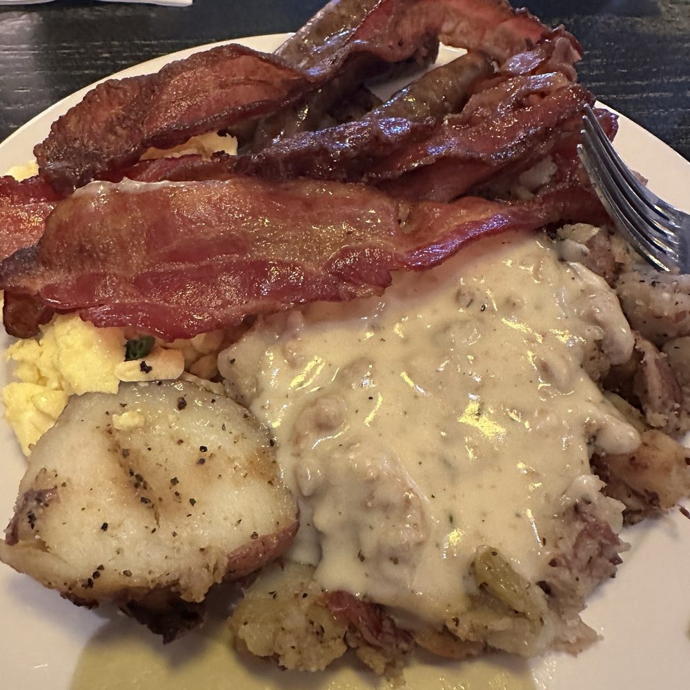 Breakfast buffet with sausage gravy on my potatoes. INCREDIBLE Breakfast buffet with sausage gravy on my potatoes. INCREDIBLE