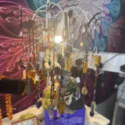 Assorted Amber, Amethyst, Mother of Pearl Pendants all hand crafted by local artist Joseph