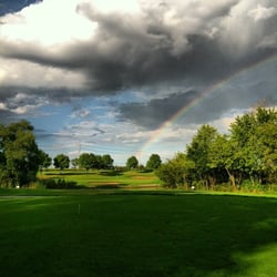 Steeple Chase Golf Club - View from the tee box with a rainbow hitting the pin!