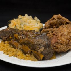 Sweet Potatoes Restaurant - Combination meal of two proteins and two side orders.
Featuring: braised beef short ribs and fried chicken