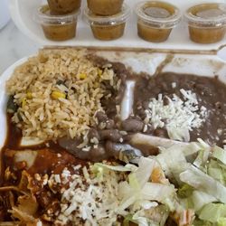 El Charro Restaurant - Chicken enchiladas, rice, beans, salad and habanero sauce.