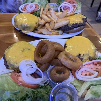 Brendan's Sports Pub - When it's "Buy one, Get one 50% off" - it means one plate (2 burgers with one side".    Burgers for days!!  Lmao - Sports Bars Near Me - Pompano Beach, Florida