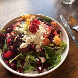Dawn Butterfly Cafe - Beet salad with chokecherry vinaigrette, edible flowers, pepitas, salad greens, yumminess.