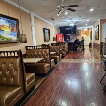 El Paraiso Honduran Restaurant - The booths seating area with the bar in the background. - Latin American Near Me - Roanoke, Virginia