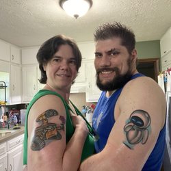 Diligent Lobotomy Tattoo - Finished WALL-E and EVE tattoos after coverings have been removed and washed and lotioned.