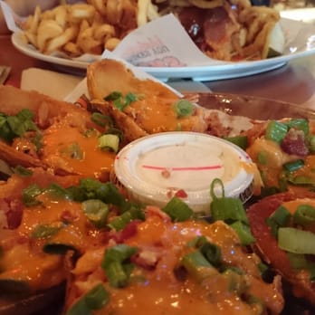 Hooters - Spicy garlic sauce on the skins! - Sports Bars Near Me - Rohnert Park, California