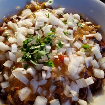 Slim's Last Chance - The brisket and beans over jalapeño mac n cheese with cheddar and onion toppings. Also very good. - Bars Near Me - Seattle, Washington