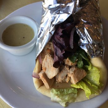 Pita Jungle - Broiled Chicken Pita with Lemon Vinaigrette as dip - Mediterranean Near Me - Phoenix, Arizona Pita Jungle - Broiled Chicken Pita with Lemon Vinaigrette as dip - Mediterranean Near Me - Phoenix, Arizona