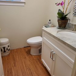 Love having the plank flooring in the powder room