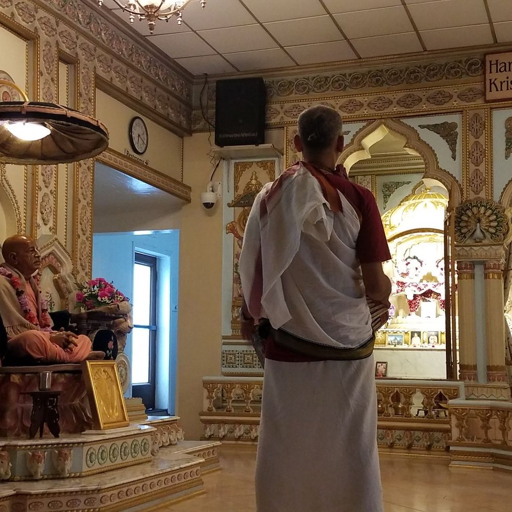 ISKCON San Diego - inside the temple facing north. Srila Prabhupada's deity or statue on left. a Devotee playing the mridangam(drum) center. - Hindu Temples Near Me - Pacific Beach, California ISKCON San Diego - inside the temple facing north. Srila Prabhupada's deity or statue on left. a Devotee playing the mridangam(drum) center. - Hindu Temples Near Me - Pacific Beach, California