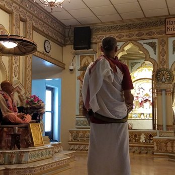 ISKCON San Diego - inside the temple facing north. Srila Prabhupada's deity or statue on left. a Devotee playing the mridangam(drum) center. - Hindu Temples Near Me - Pacific Beach, California