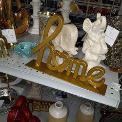 Burlington - Home decor prices for bookshelves or paper weights.
