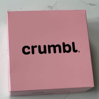 Crumbl - Spokane Valley - Cereal Milk Cookie A soft cereal-inspired sugar cookie brushed with a milky glaze and topped with vibrant, fruity cereal. - Bakeries Near Me - Spokane Valley, Washington