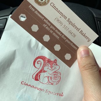 Cinnamon Squirrel Bakery - a hand holding a business card - Desserts Near Me - Redlands, California